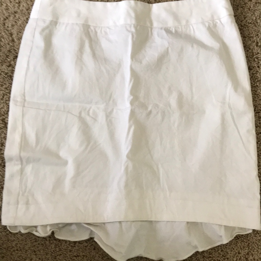White skirt with fish tail in the back